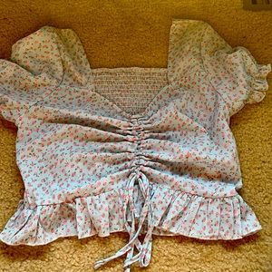 Puff sleeved light blue floral ruffle top